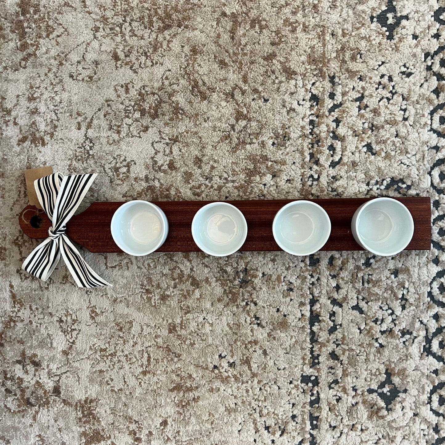 Handcrafted sapele wood flight board, 24 inches long, featuring 4 mini cup bowls—ideal for dips, sauces, or tasting flights.