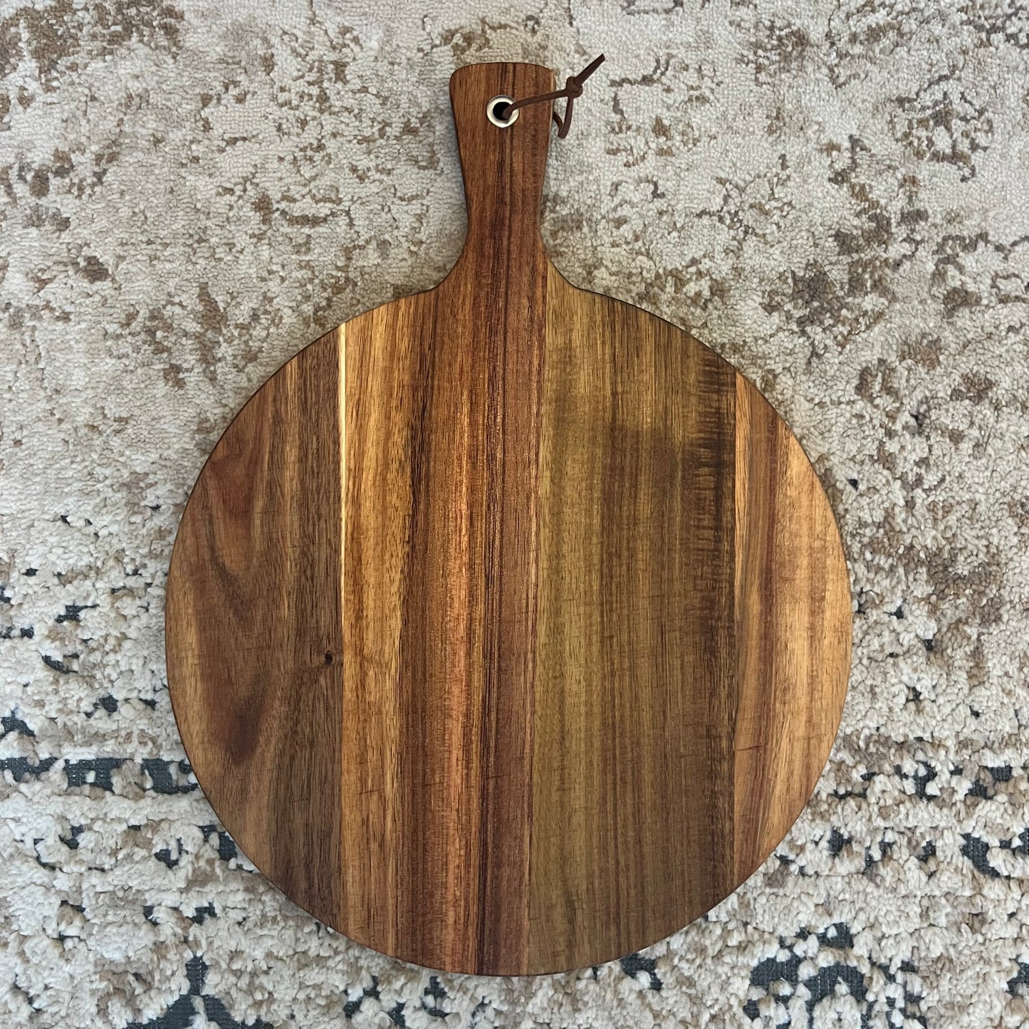 Handcrafted from beautiful acacia wood, our Large Round Charcuterie Board is designed for both artistry and function. Measuring approximately 15.5" x 11.75