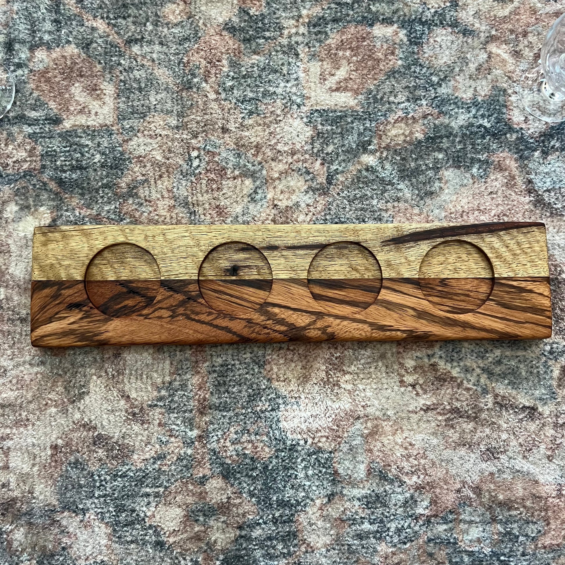 Handcrafted bourbon and whiskey flight board made from Black Limba and Zebrawood with four glass carafes 2