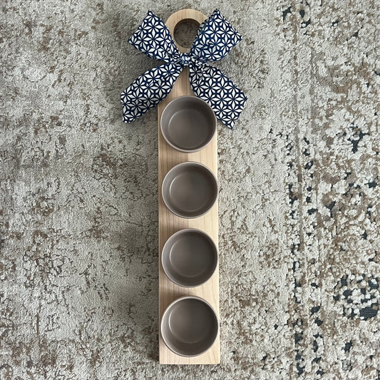 Cherry and maple flight board with 4 tan glass bowls. Approx. 24x4”. Perfect for dips, sauces, and stylish serving. Handcrafted and one of a kind.