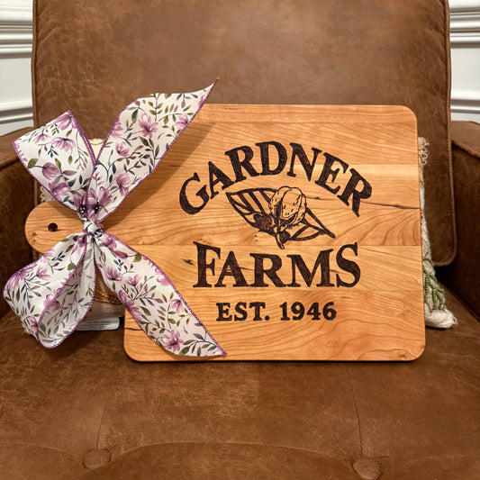 Gardner Farms original logo on cherry rectangle board with handle