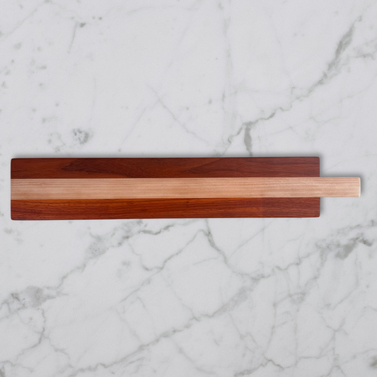 Wooden charcuterie board on a marble surface