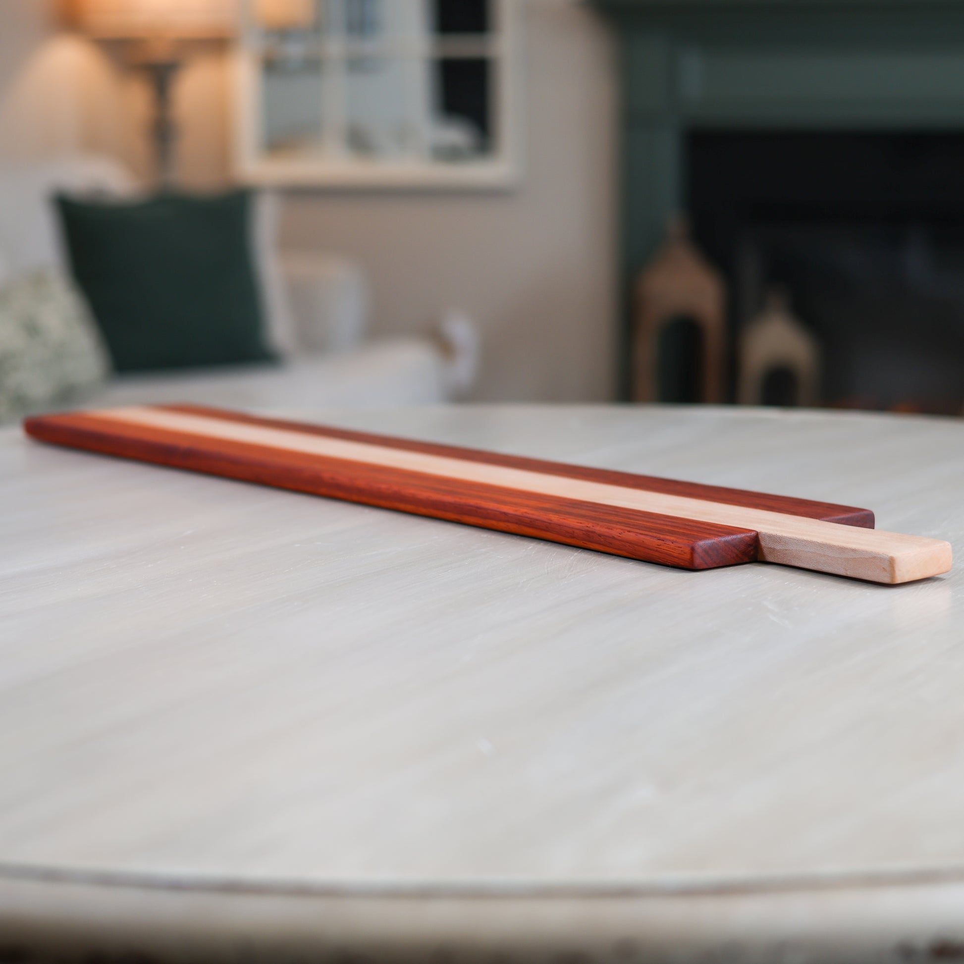 Wooden charcuterie board with an indoor setting