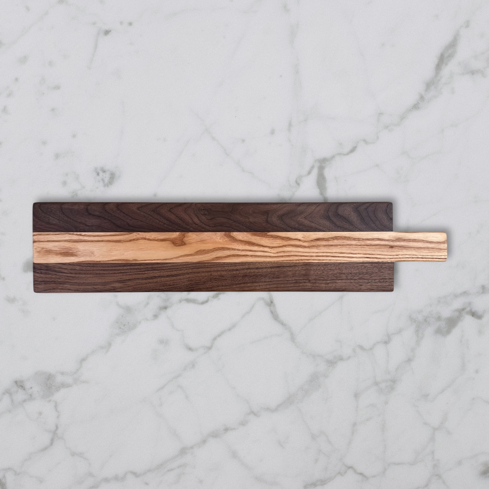 Wooden charcuterie board on a marble surface