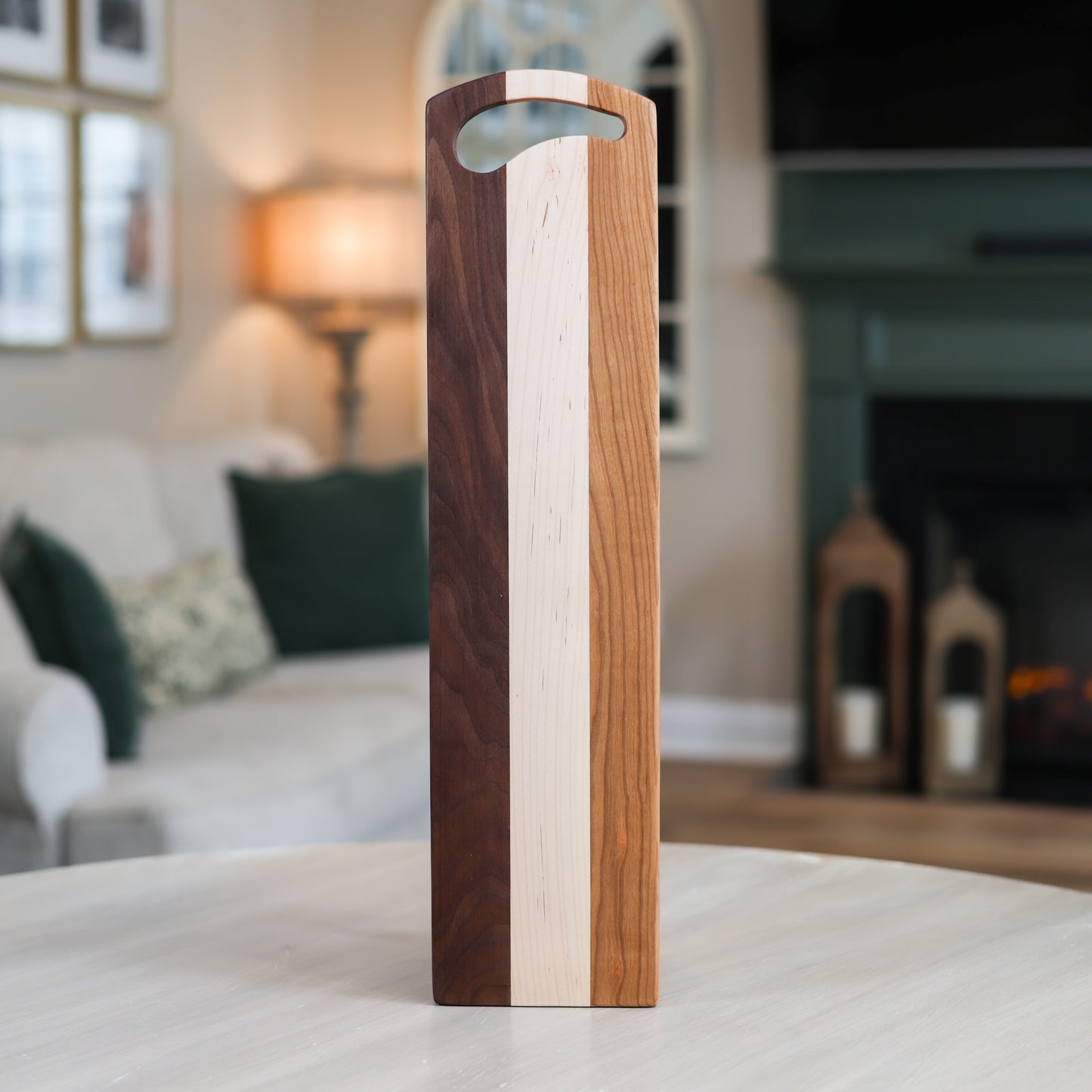 Wooden Charcuterie board with a handle in a living room