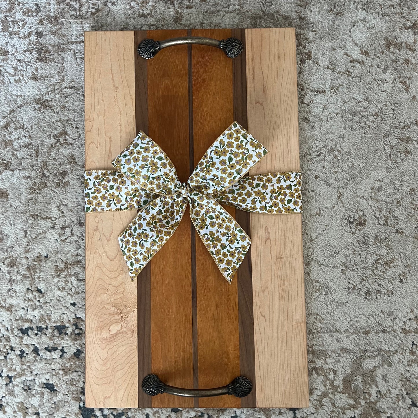 Serving tray made from canary, maple, and walnut wood with handles, approximately 22 by 10.5 inches, handcrafted with warm contrast and smooth finish.