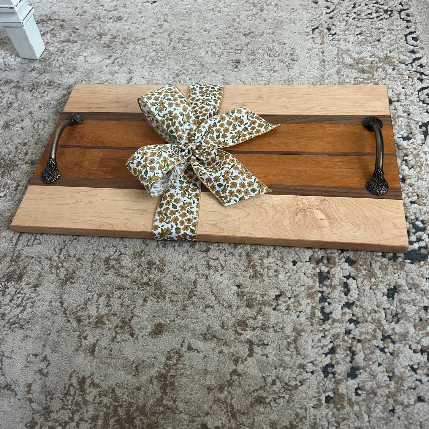Serving tray made from canary, maple, and walnut wood with handles, approximately 22 by 10.5 inches, handcrafted with warm contrast and smooth finish.