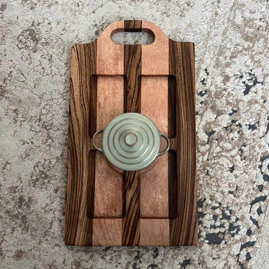 Handcrafted zebrawood and okoume woven board with handle and included mini sage green Dutch oven