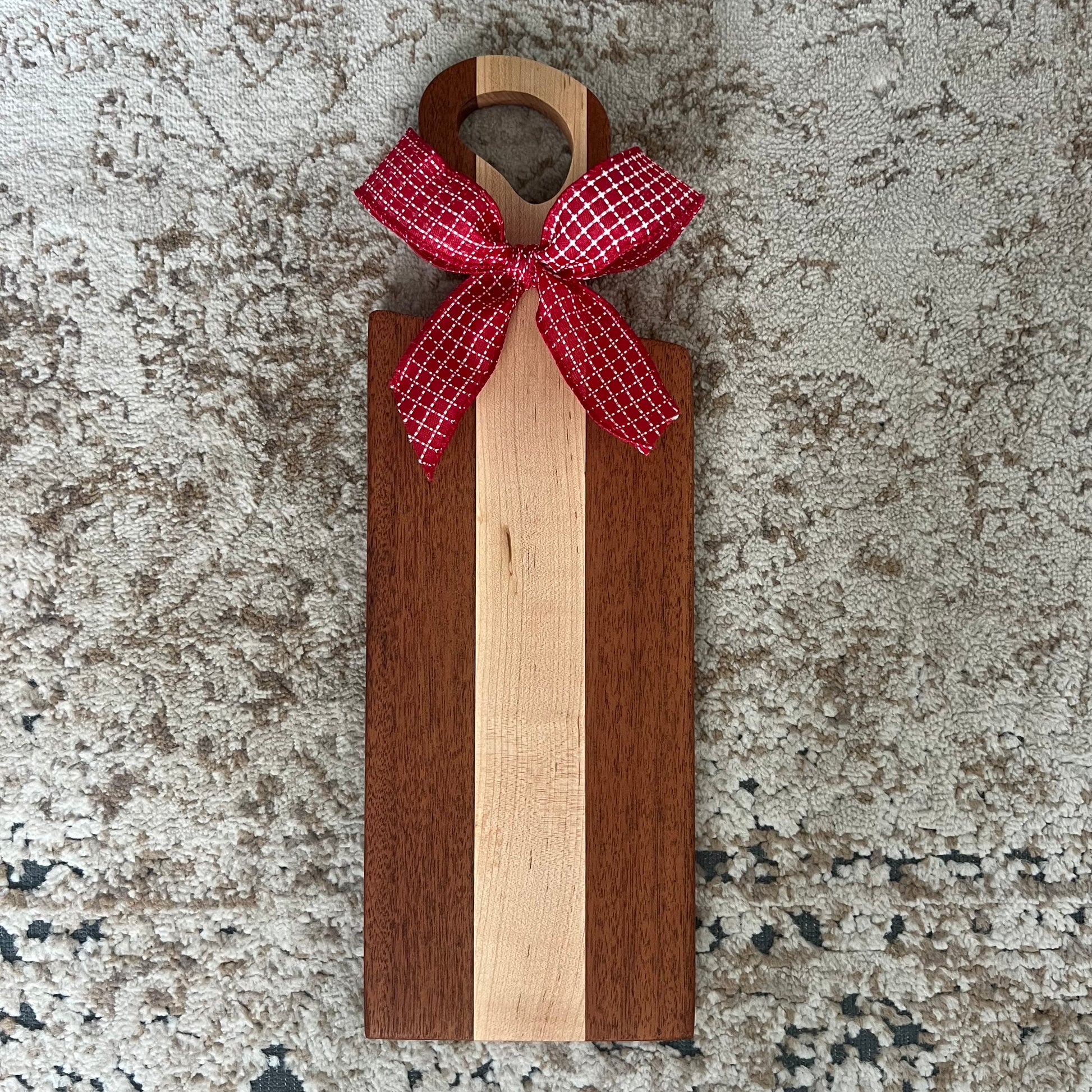 Merbau and cherry wood bread board, handcrafted and measuring 17.5 x 6 inches with a smooth finish and rich wood grain.