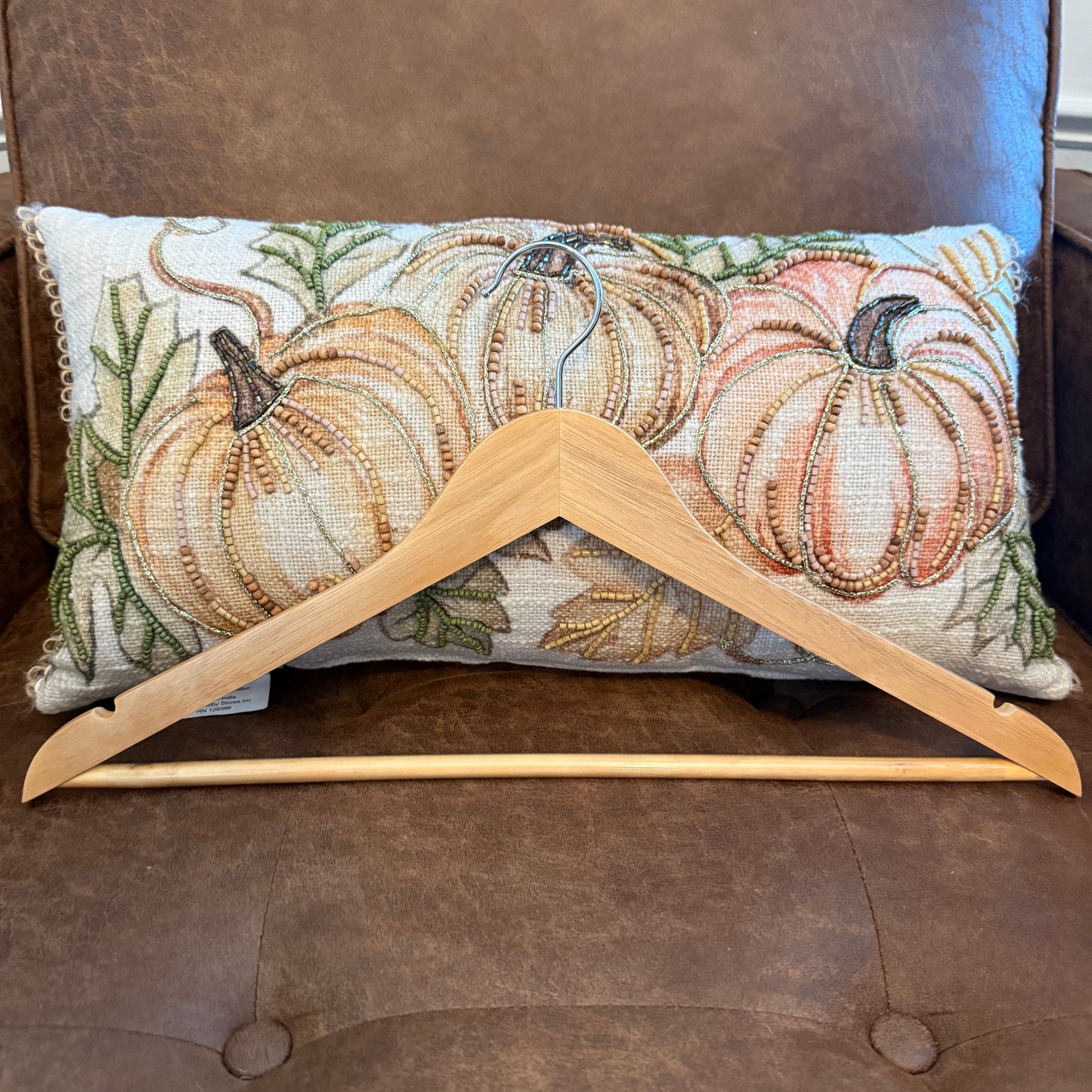 “Natural wooden adult hanger with smooth finish and metal hook, handcrafted by Boards & Bubbles.”